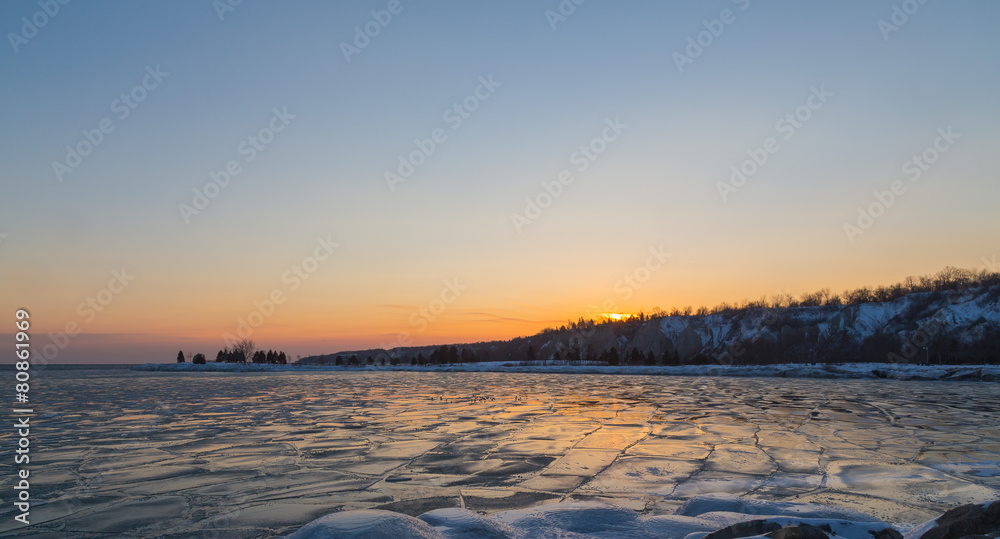 Scenic Sunset over a Frozen Lake