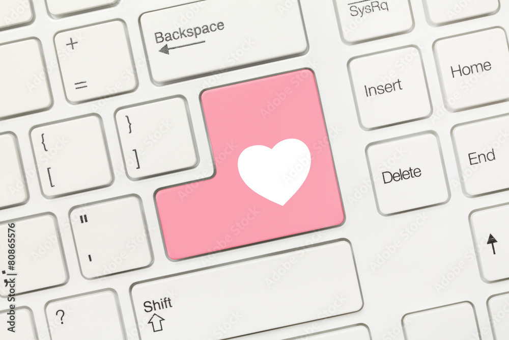 White conceptual keyboard Pink key with heart symbol Stock Photo