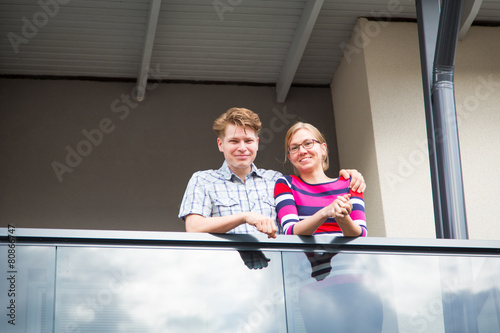 Couple relaxing at the balcony