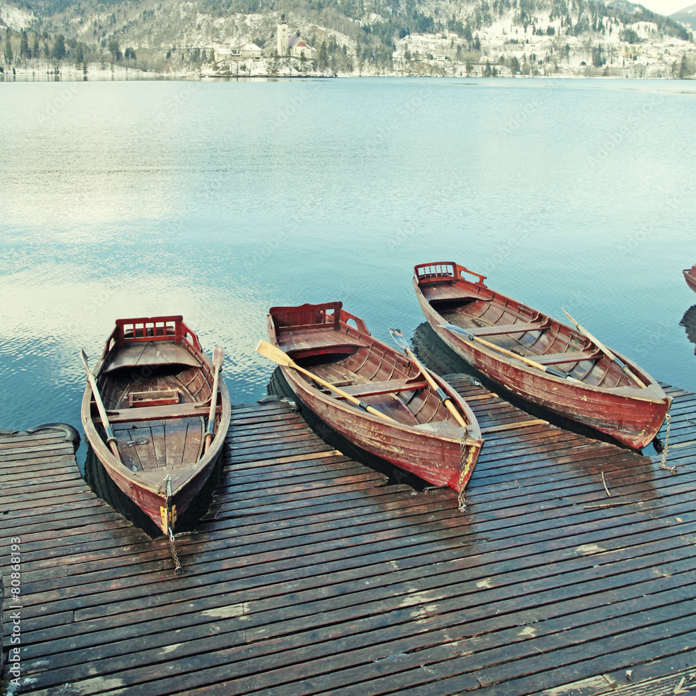 wooden boats on picture perfect lake Bled, Slovenia.