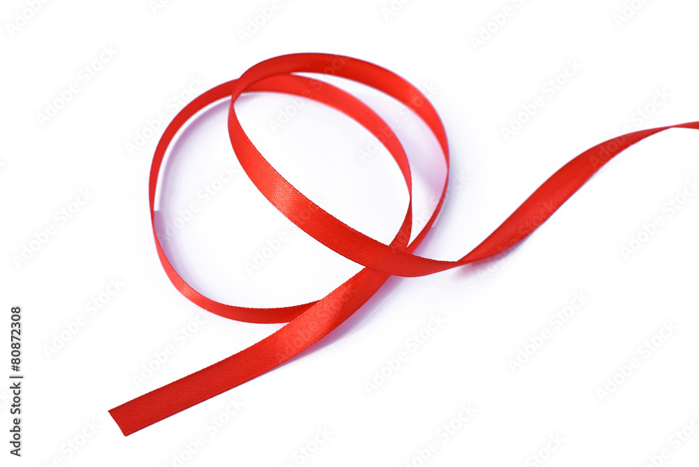 Shiny colorful red satin ribbon on white background Shiny colorful red satin ribbon on white background