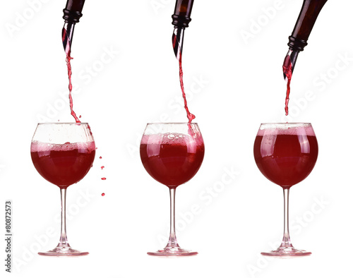 Red wine in glass pouring from bottle make splash dispenser