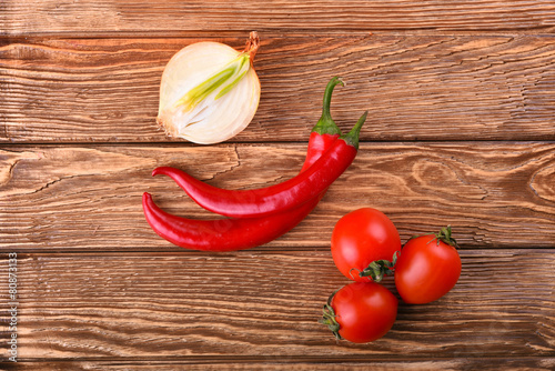 Fototapeta Naklejka Na Ścianę i Meble -  Juicy tomato cherry, white onion and red hot chili pepper