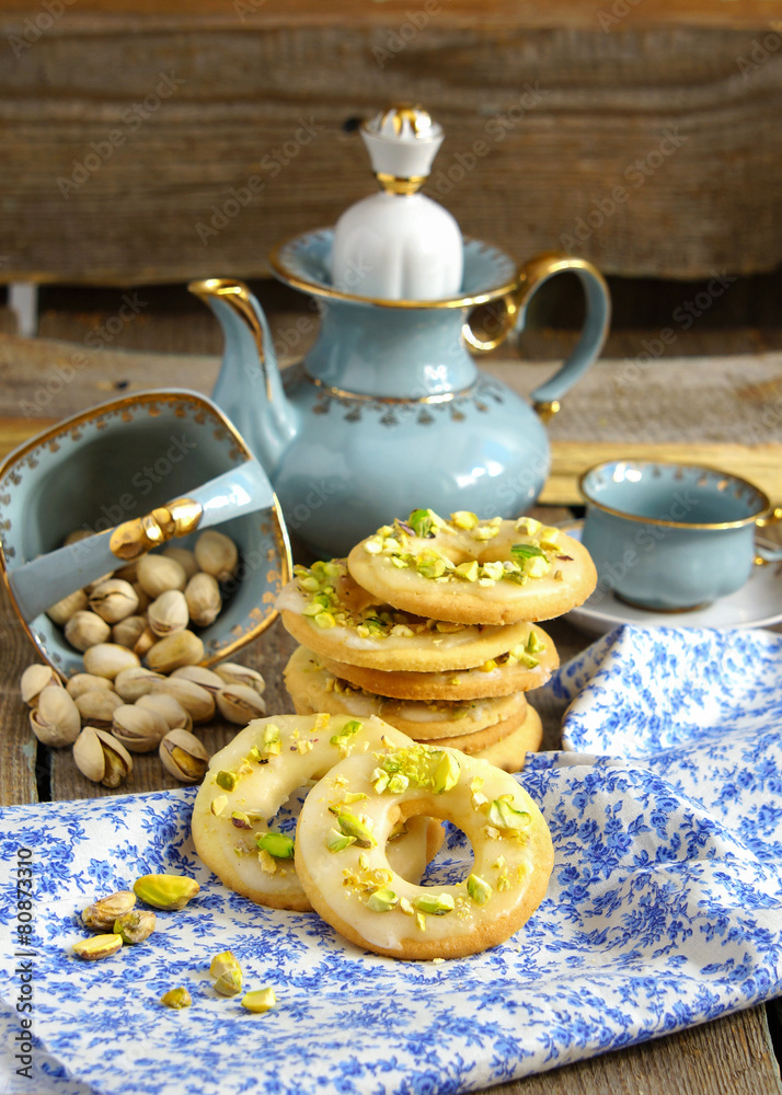 lemon cookies in the form of rings with pistachios and icing lemon cookies in the form of rings with pistachios and icing