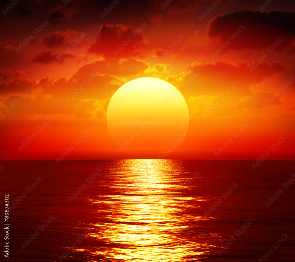 sunset over calm sea