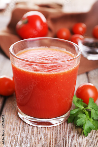 Glass of tomato juice with cherry tomatoes