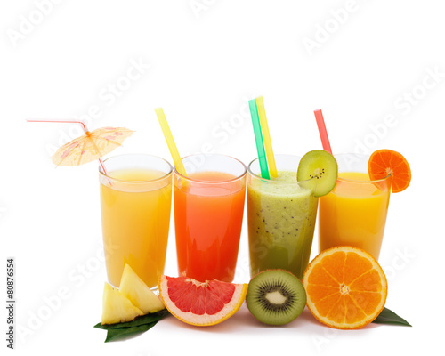 Tropical fruits and juice isolated on white