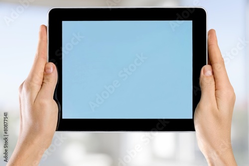 Tablet. Female hands holding a tablet touch computer gadget with