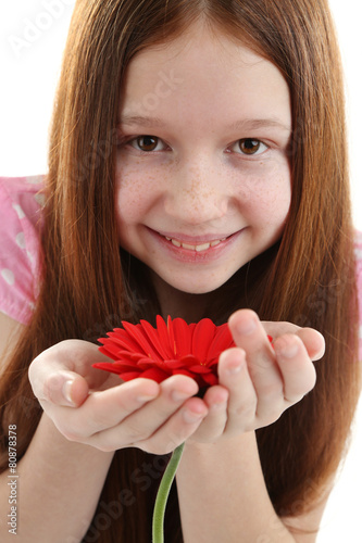 Beautiful little girl with flower, isolated on white