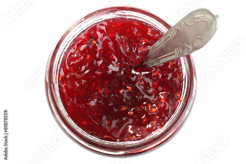 spoon in a jar of jam isolated