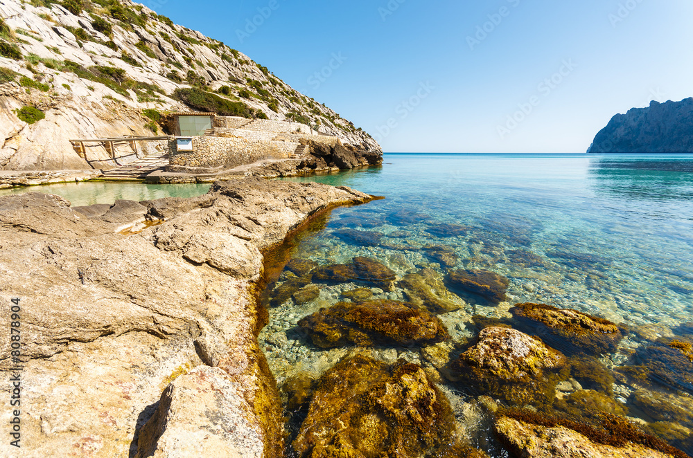 Rocks in sea water of Cala San Vicente bay, Majorca island