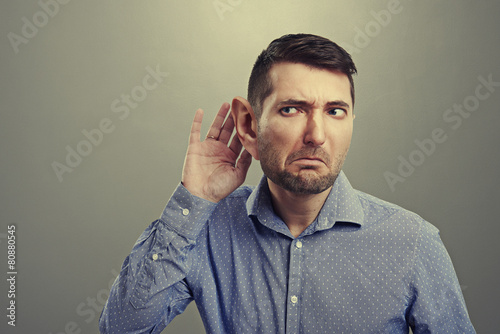concerned young man with big ear