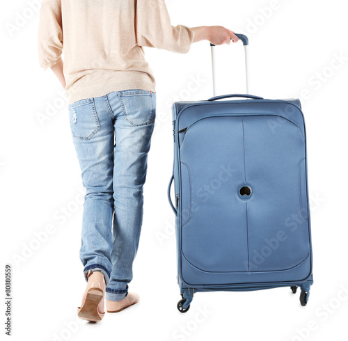 Woman pulling suitcase, isolated on white