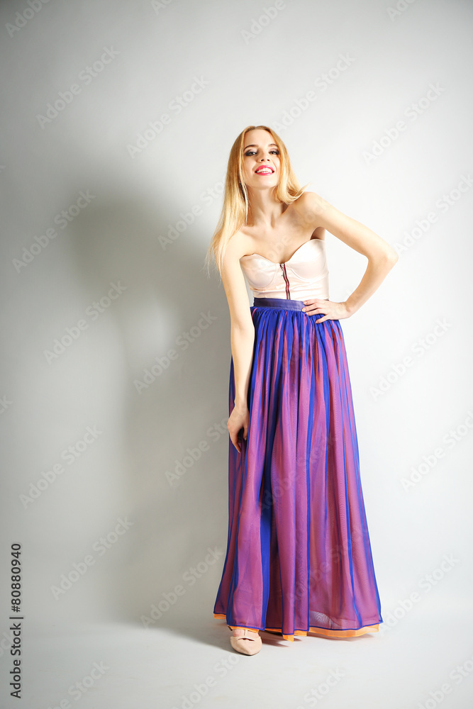 Expressive young model on gray background Expressive young model on gray background