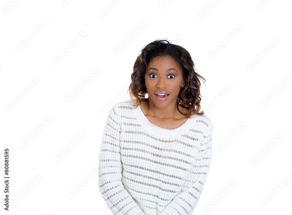 Closeup portrait surprised young woman looking at you camera Closeup portrait surprised young woman looking at you camera