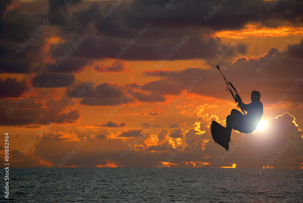 Fototapeta premium Kite surfing at sunset