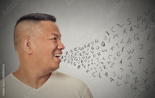 Obraz na plátně man talking with alphabet letters coming out of open mouth