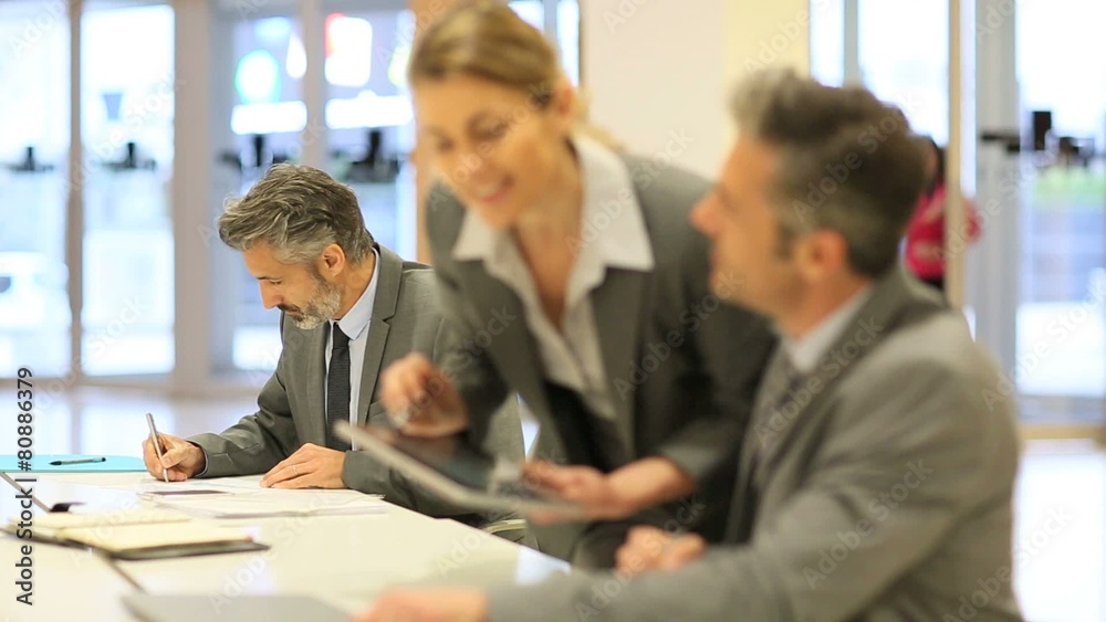 Business partners working together in office Business partners working together in office