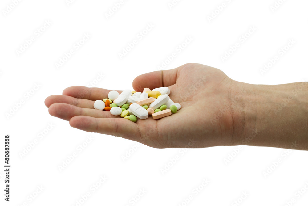Heap of different pills, tablets and capsules in the man hand Heap of different pills, tablets and capsules in the man hand