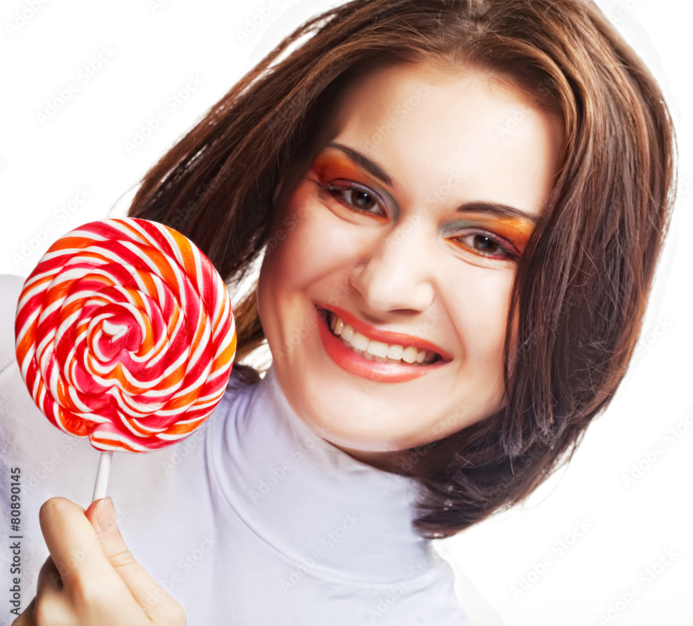 Pretty young woman holding lolly pop.