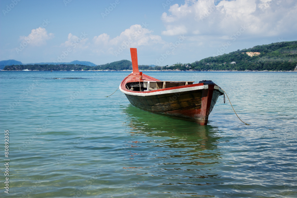 Thai wooden boat on a calm sea