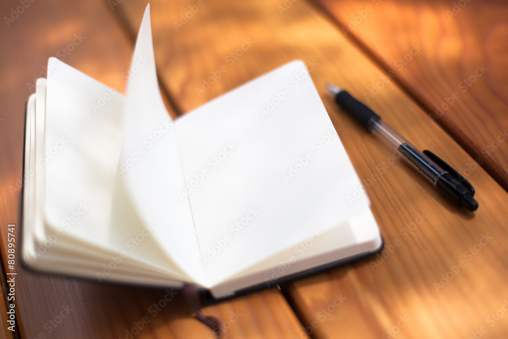 Notepad on a wooden table Notepad on a wooden table
