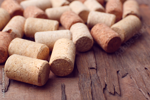 Wine corks on rustic wooden table background