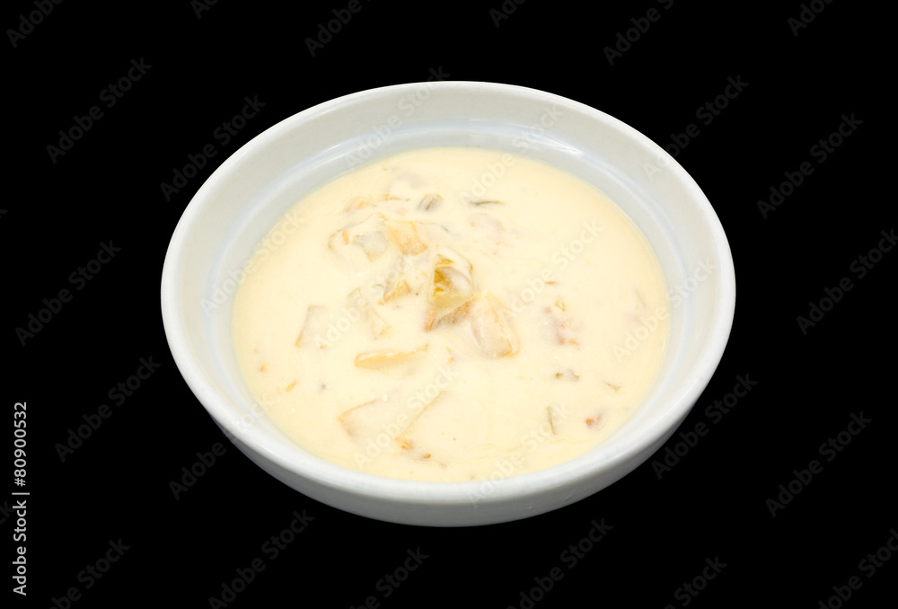 Bowl of clam chowder on a black background Bowl of clam chowder on a black background