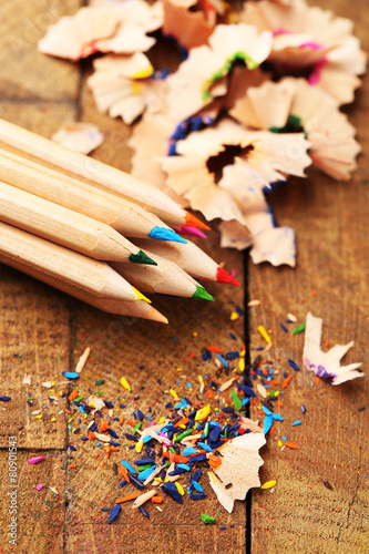 Wooden colorful pencils with sharpening shavings,