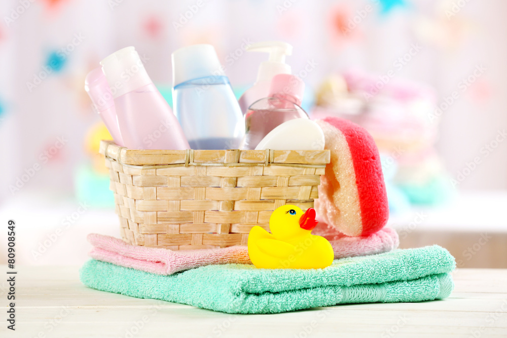 Baby accessories for bathing on table on light background Baby accessories for bathing on table on light background