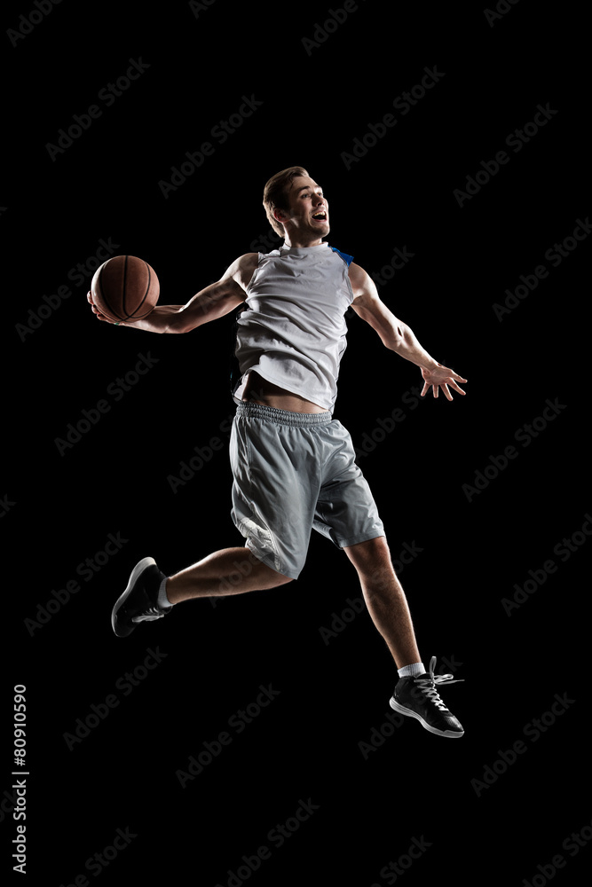 Basketball player in action is flying high Basketball player in action is flying high