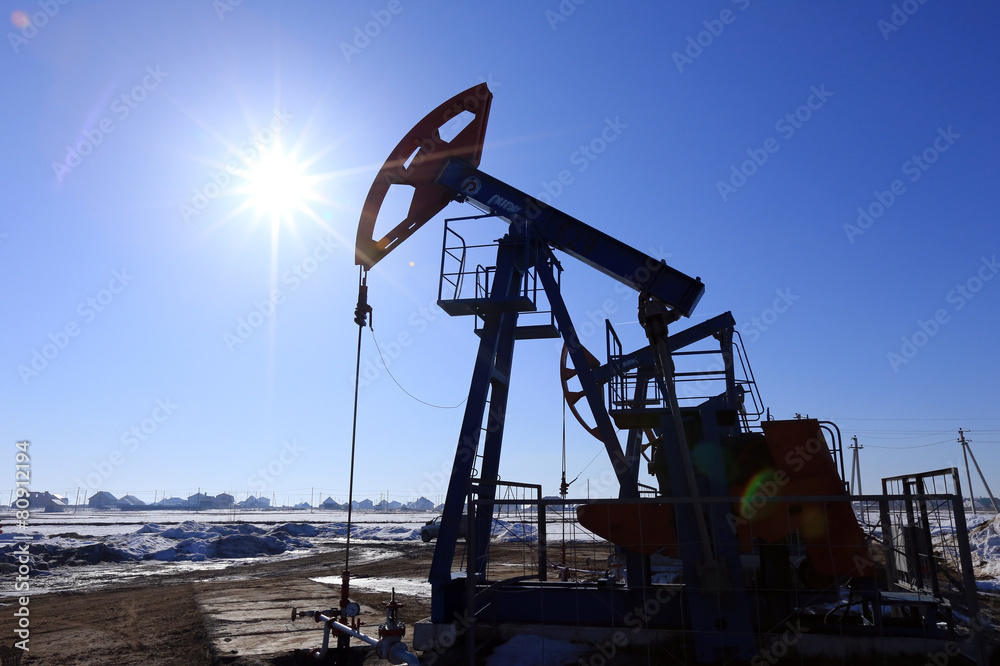 oil pumps in a field in spring oil pumps in a field in spring