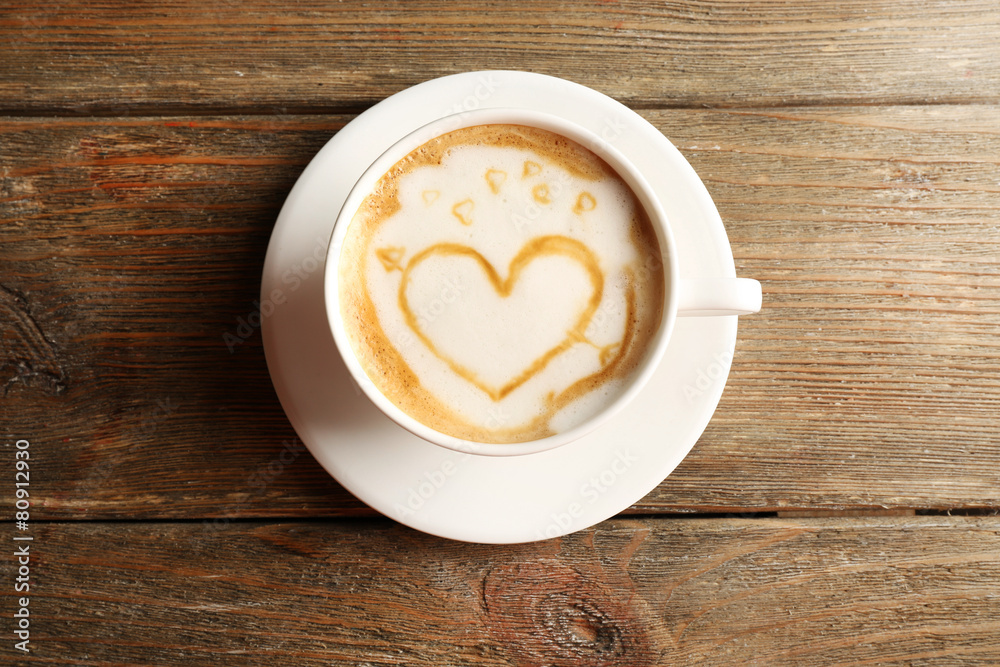 Cup of coffee latte art on wooden background Cup of coffee latte art on wooden background