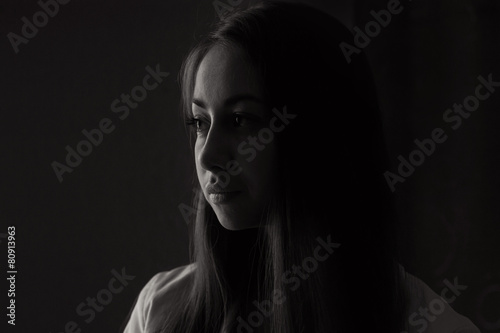 Beautiful girl looking out the window