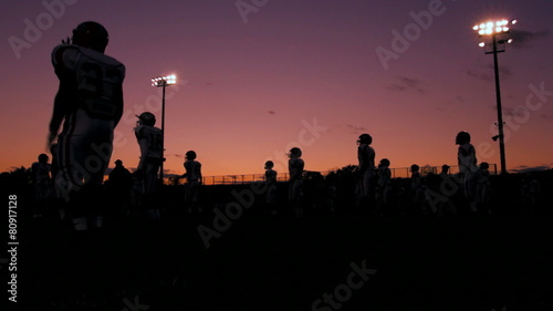 Football Players Jumping Jacks Shilouette