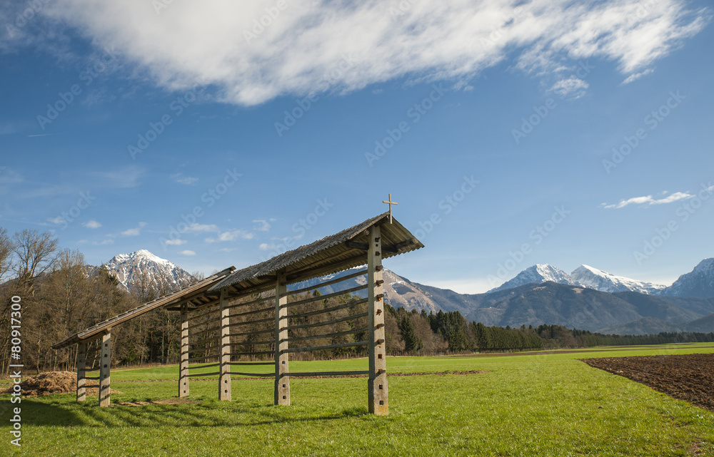 Hayrack on meadow in gorenjska region, Slovenia Hayrack on meadow in gorenjska region, Slovenia