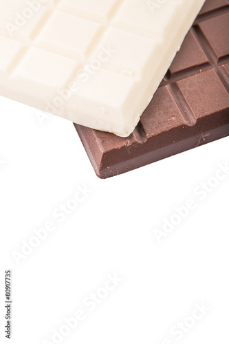 White and dark brown chocolate bars over white background