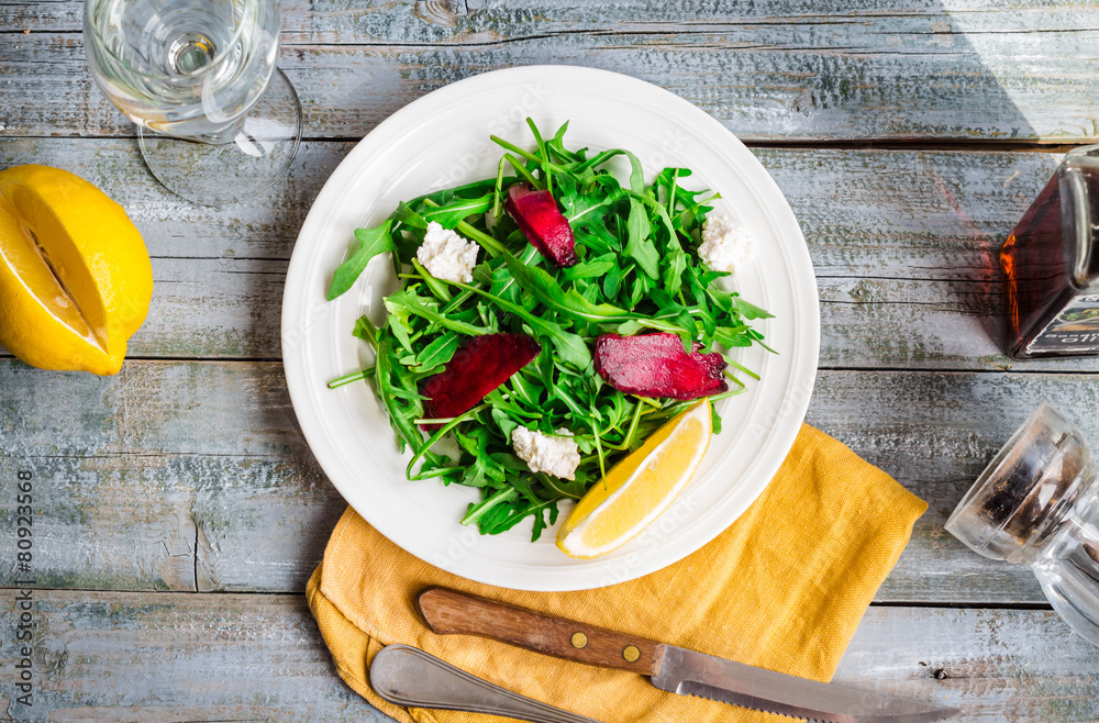 green salad with arugula beet and goat cheese, lemon, organic fo