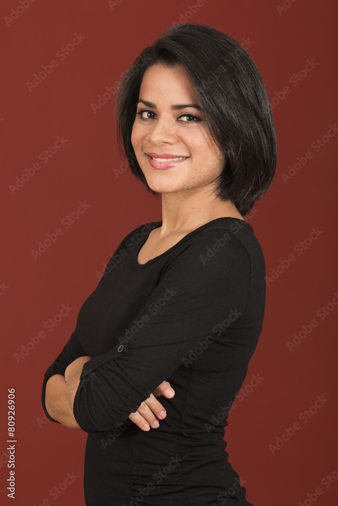 Beautiful latin woman smiling with her arms crossed Beautiful latin woman smiling with her arms crossed