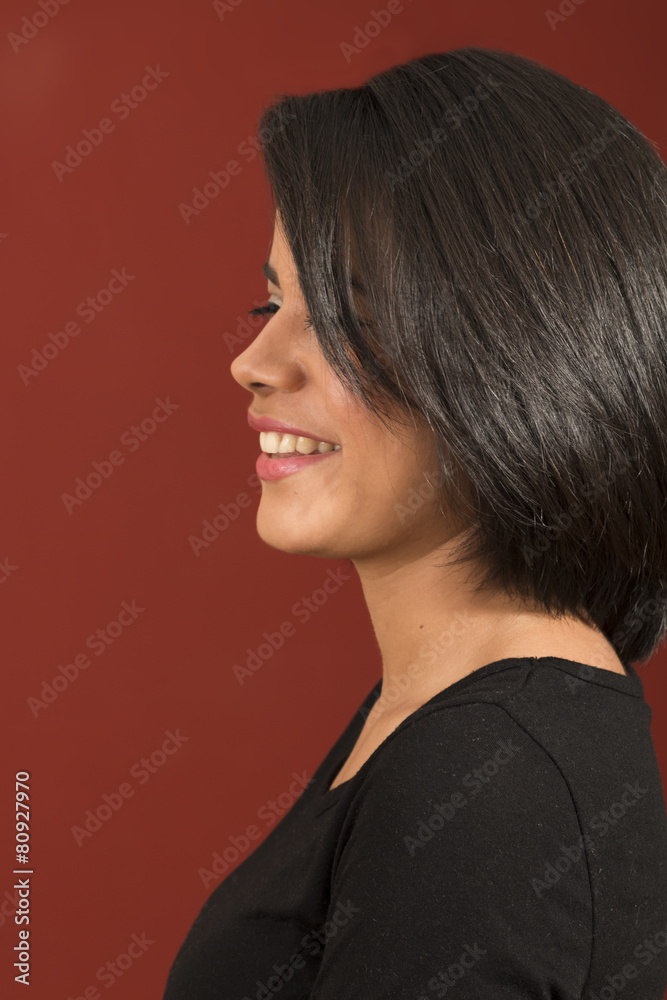 Beautiful latin woman side view and smiling Beautiful latin woman side view and smiling
