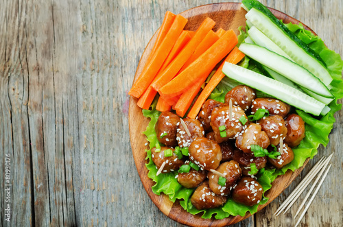 meatballs with Teriyaki sauce and sesame seeds