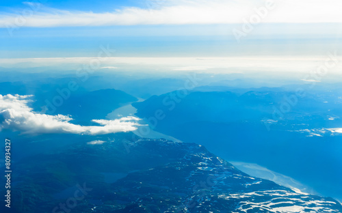 View from window of airplane flying over Norway Scandinavia.