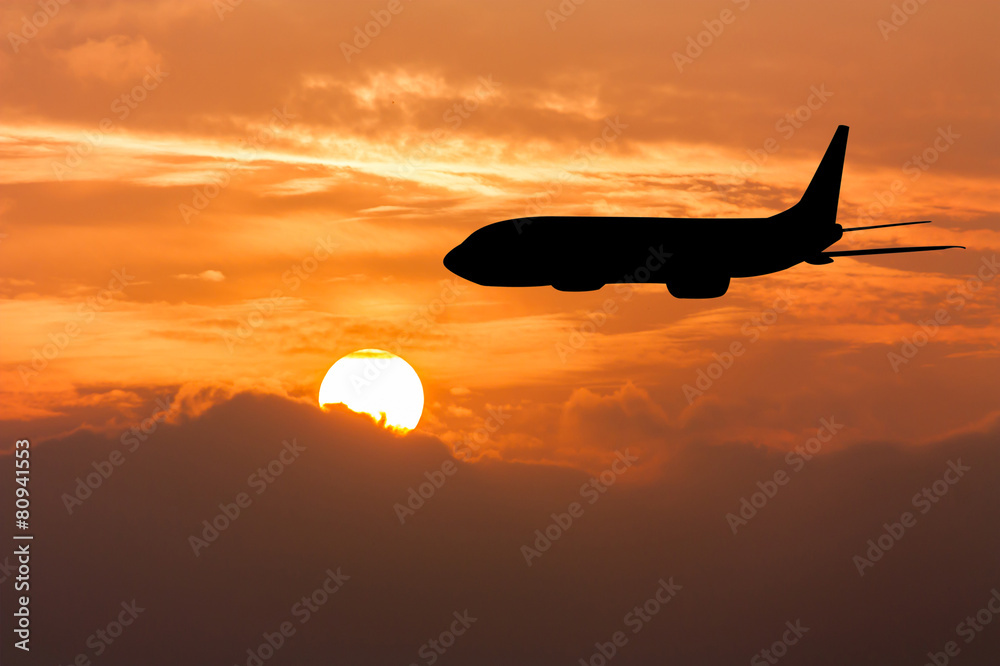 Naklejka Silhouette of Airplane on big sunset