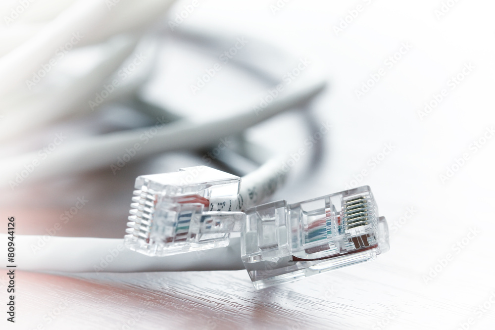 close up of RJ45 Plug Lan Network on wood desk close up of RJ45 Plug Lan Network on wood desk
