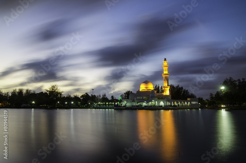 Kuala Ibai Mosque Reflection and blur sky background photo