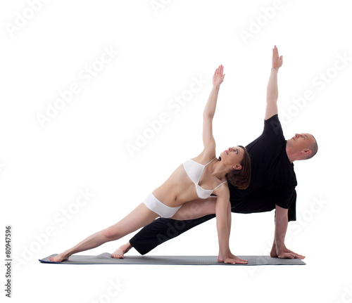 Healthy athletes doing yoga exercises