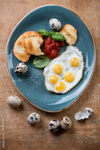 Tableau sur toile Breakfast fried eggs with toasted bread, above view, studio shot