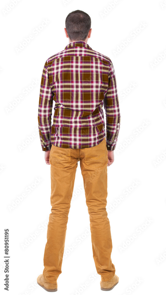 Back view of handsome man in checkered shirt looking up. Back view of handsome man in checkered shirt looking up.