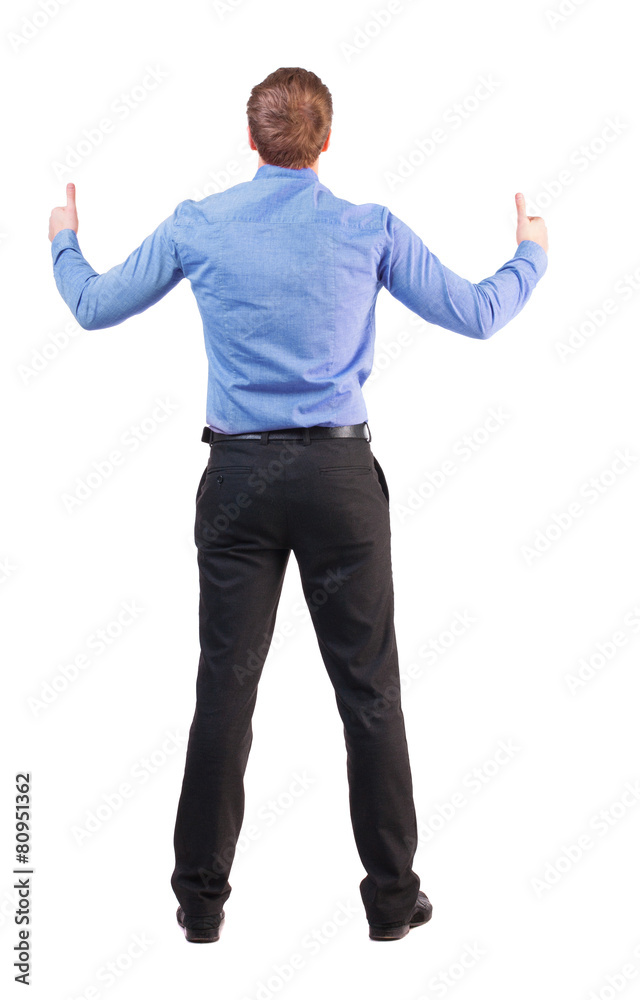 Back view of business man shows thumbs up. Back view of business man shows thumbs up.