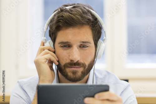 One man watching a movie on a tablet pc